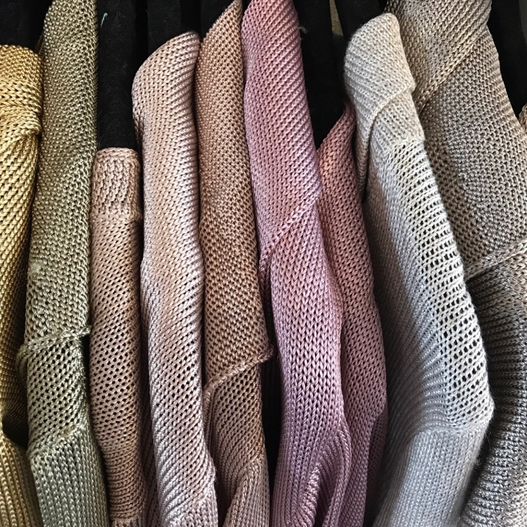 Hand-loomed knits up close, in gold, olive, blush, mauve and grey